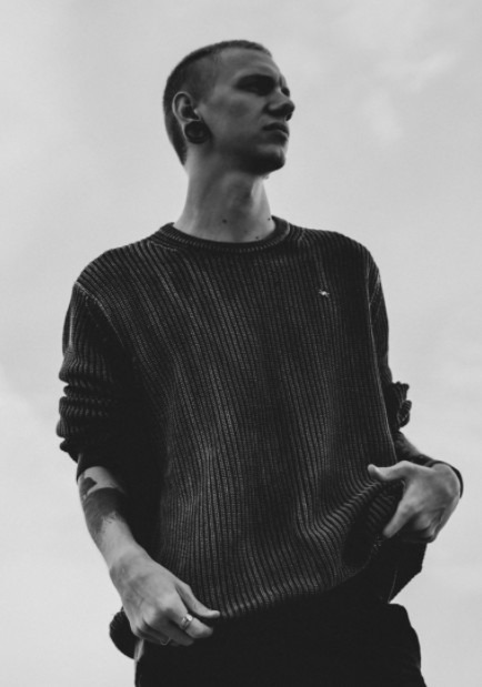 Man wearing a sweater in black-and-white