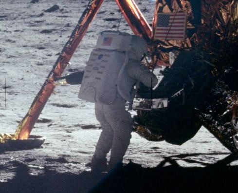 Neil Armstrong stepping on the surface of the moon