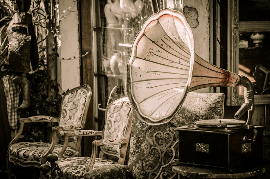 A vintage speaker connected to a gramophone. 
