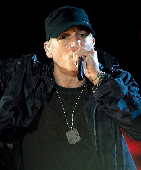 An image of Eminem performing on stage