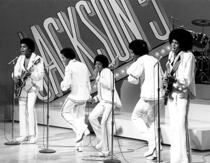Michael Jackson in the middle as a member of the Jackson 5