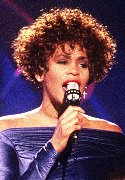 Young Whitney Houston performing on stage