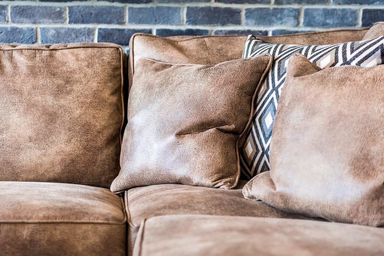 leather throw pillows on the sofa