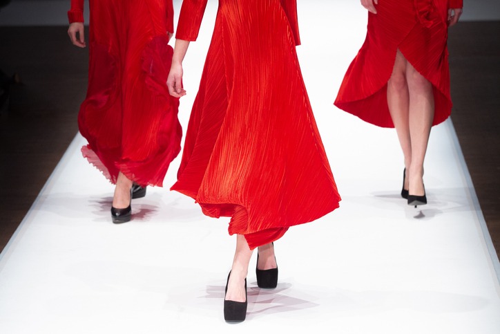 models wearing red dresses