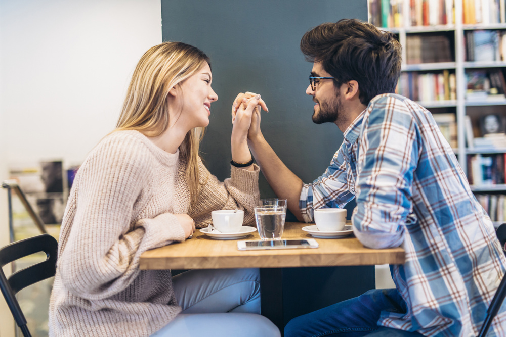 Couple in cafe enjoying the time spending with each other