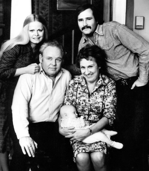 The Bunkers and the Stivics: standing, Gloria (Sally Struthers) and Michael (Rob Reiner). Seated, Archie (Carroll O'Connor) and Edith (Jean Stapleton) with baby Joey