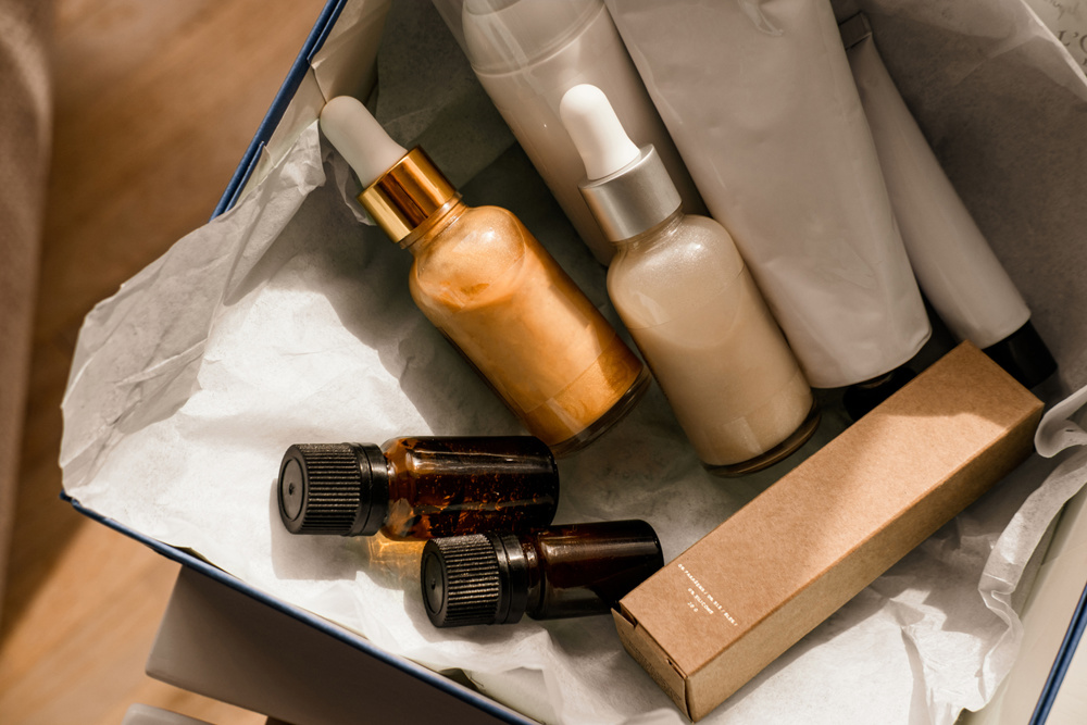 Beauty box set, bottles of natural cosmetics. Blogger skincare, face, hair and body essentials, salon treatments. Overhead, minimalism package, branding mockup